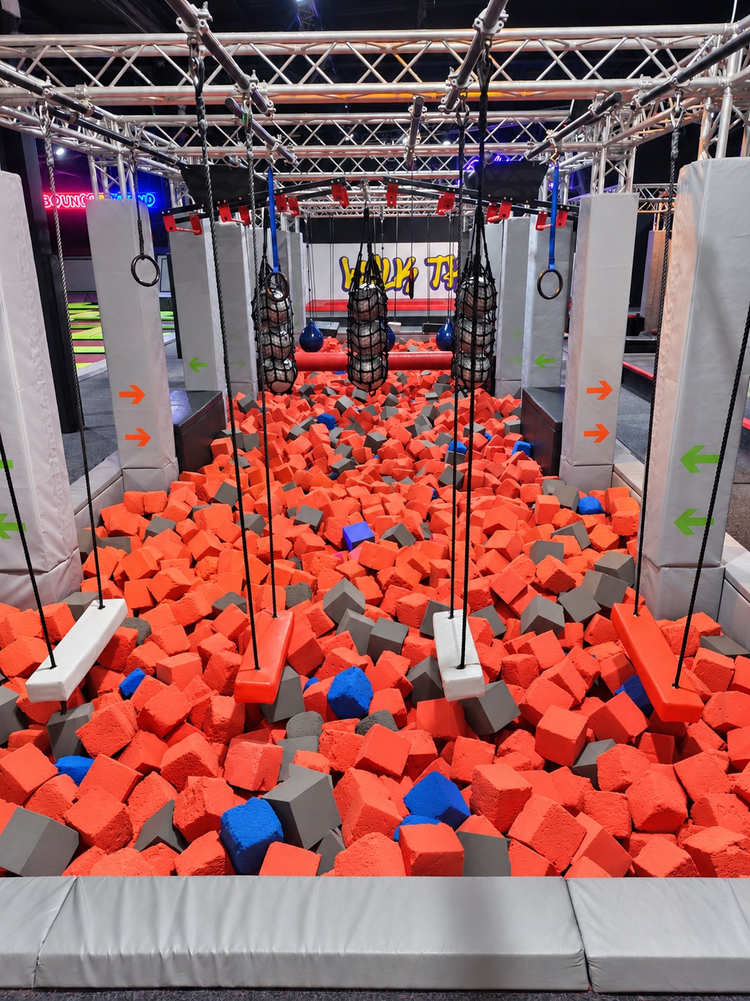 Ninja obstacle course over the foam pit at Bounce n Beyond